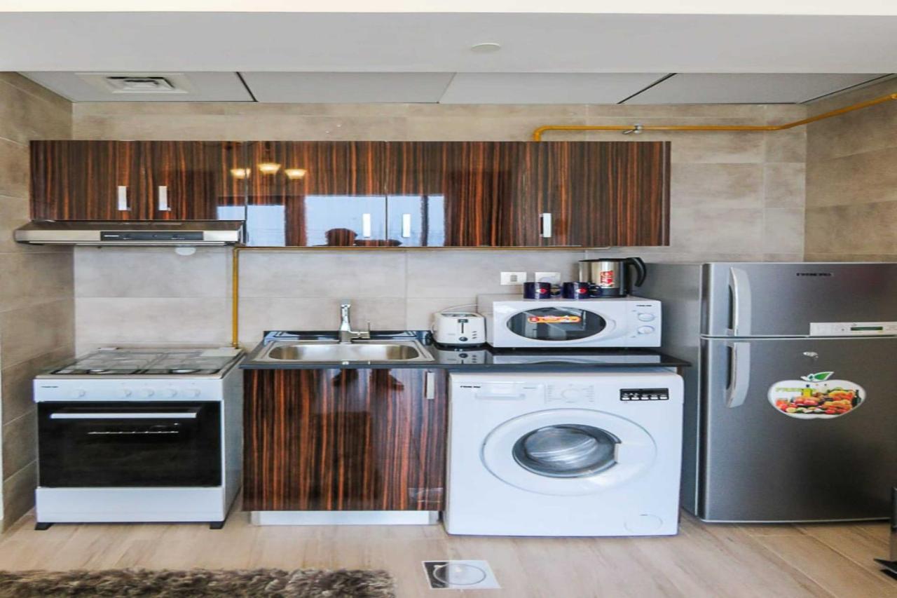 Oyo 860 Studio Apartment, Maya Tower 4, Jumeirah Village Triangle Dubaj Kültér fotó